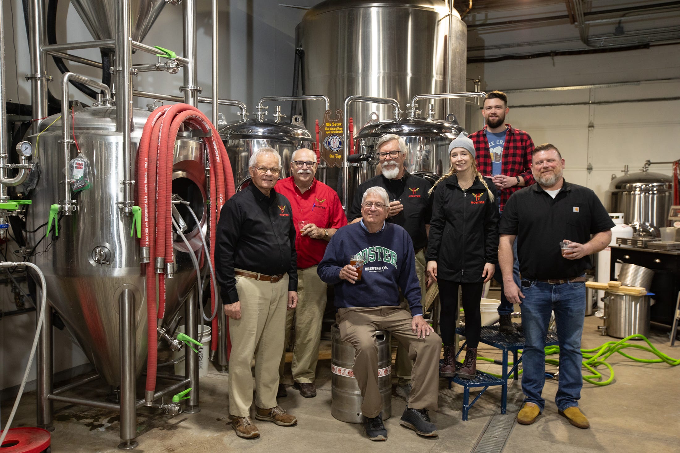 Hoster Brewing Co. is making a comeback with a new brewery and taproom. Pictured in the James Road facility are: Jay Hoster, seated, with (from left) brewer Don Croucher, owner Daniel Meyers, brewmaster Victor Aume, director of yeast management Andrea Grassbaugh, senior brewer Quinn Bartlett and operations manager Brad Schweitzer.