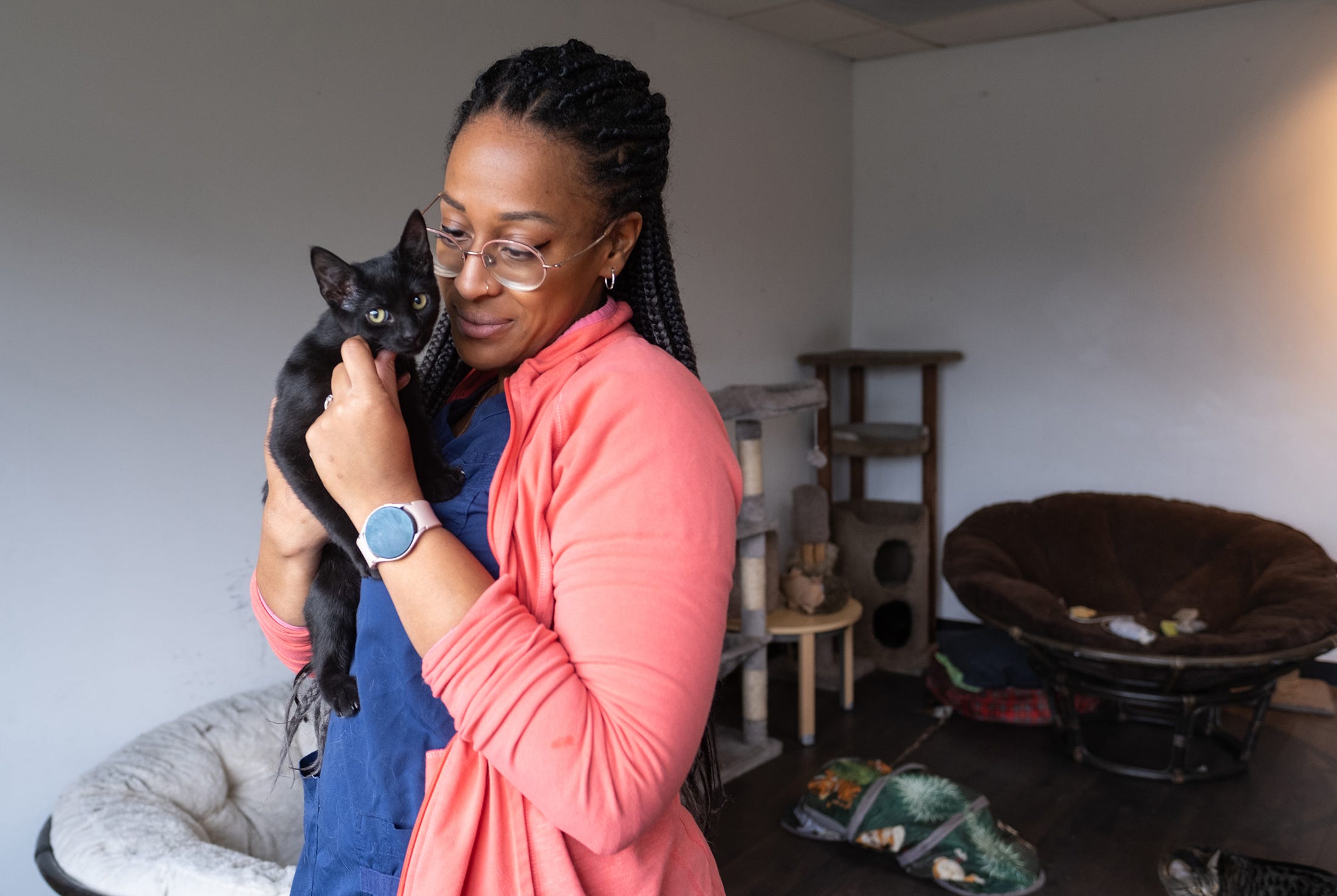 Breona Baines with a cat up for adoption at CO-PAW, a nonprofit veterinary clinic that caters to underserved communities and rescue groups. The clinic is in Columbus’ Fifth by Northwest neighborhood. (Photo by Tim Johnson)